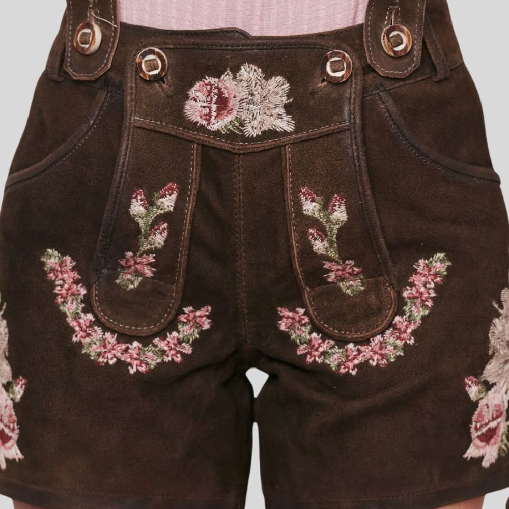 Celebrate in style with these affordable women’s lederhosen, adorned with floral embroidery. A budget-friendly option for those seeking traditional Bavarian charm.