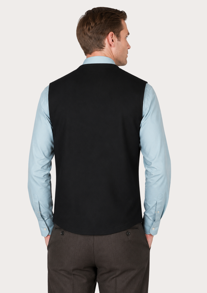 Classic black Loden wool vest designed for heritage-inspired outdoor and festival wear