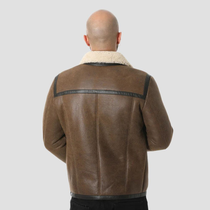 Men’s brown lambskin leather jacket with cozy curly wool lining.