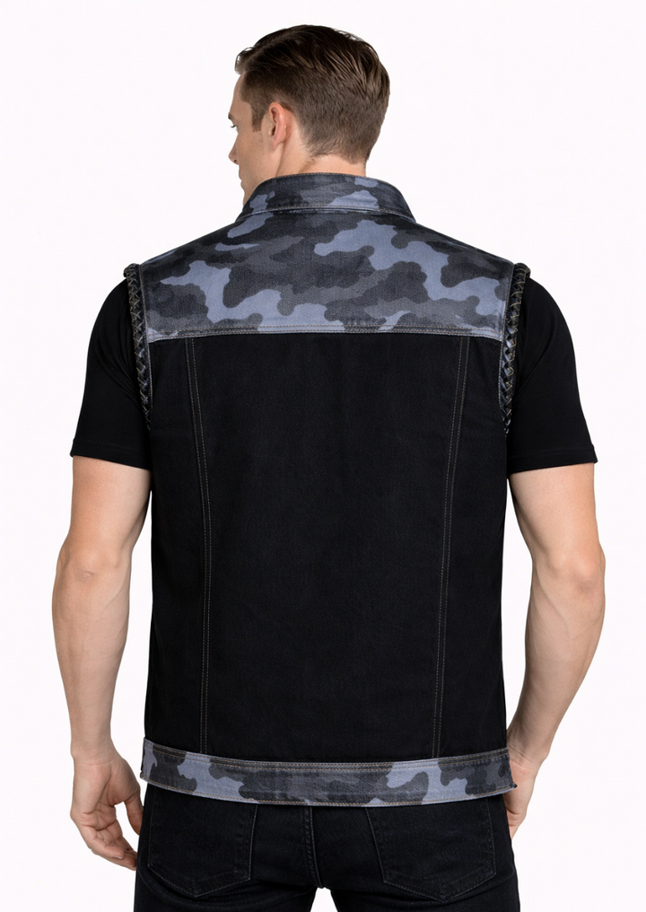 Man wearing a black denim vest with camouflage pattern