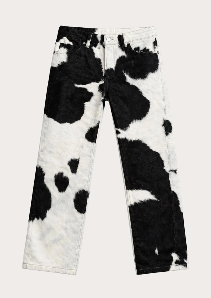 Western style cowhide leather pants featuring bold black and white hide pattern