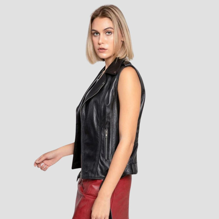 A chic women’s leather motorcycle vest with sleek zipper details, perfect for edgy street fashion and added comfort.