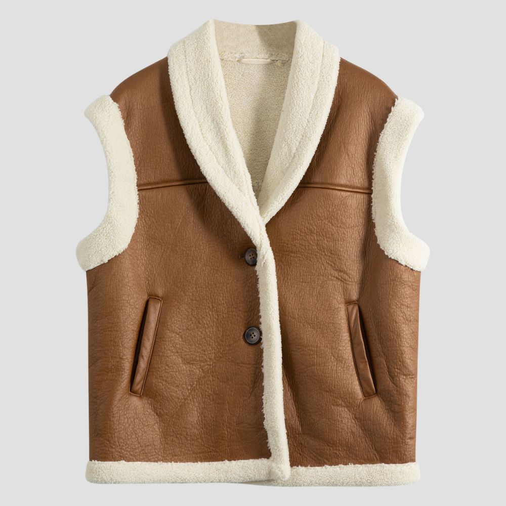 Women’s shearling leather vest with sophisticated fur accents, perfect for layering over outfits to create an elegant and cozy look.