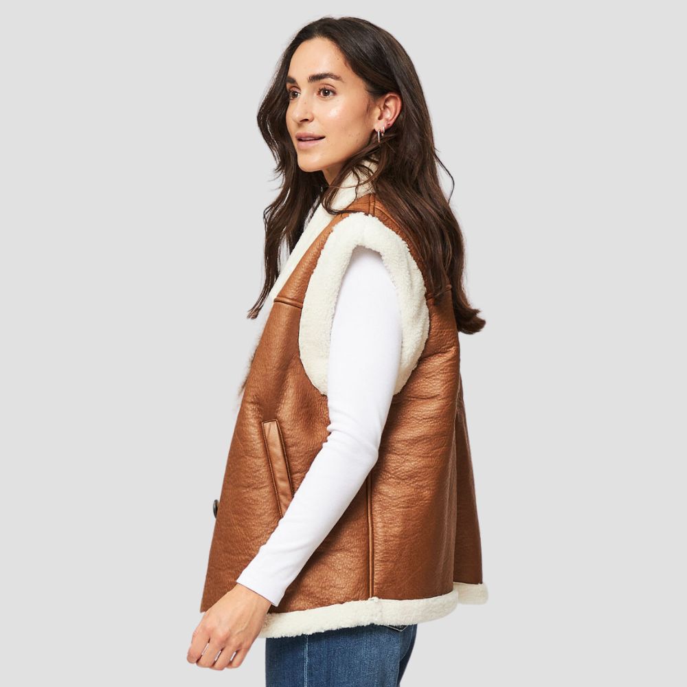 A stylish shearling leather vest for women with chic fur accents, perfect for adding a touch of luxury and warmth to casual outfits.