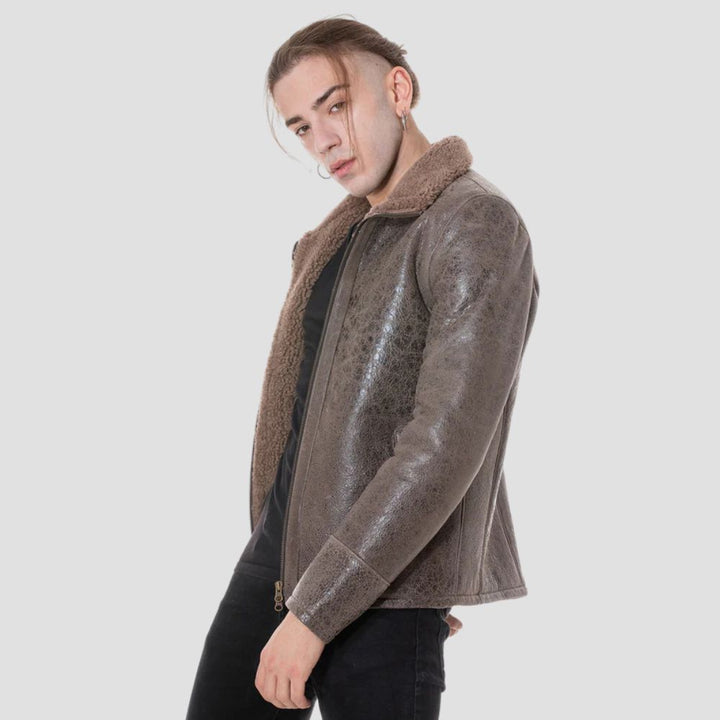 Distressed brown leather jacket with curly brown faux fur lining.
