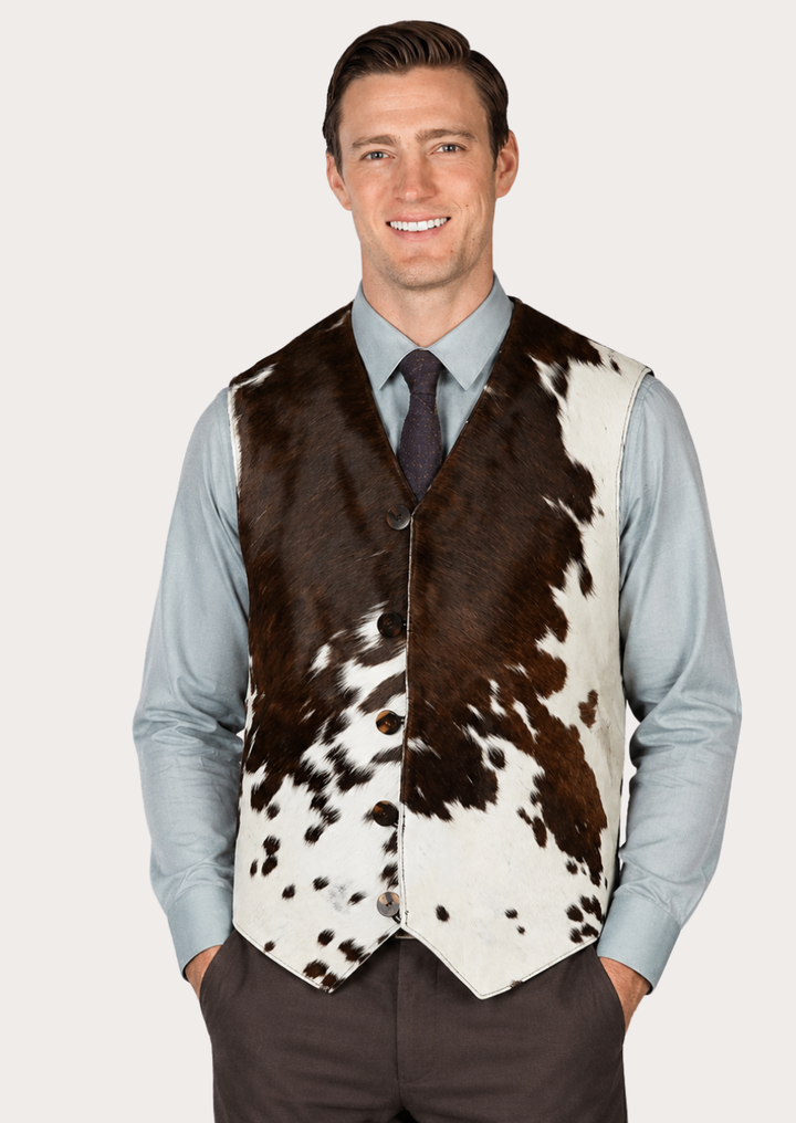 Western cowboy vest featuring a natural cowhide pattern and button-front closure