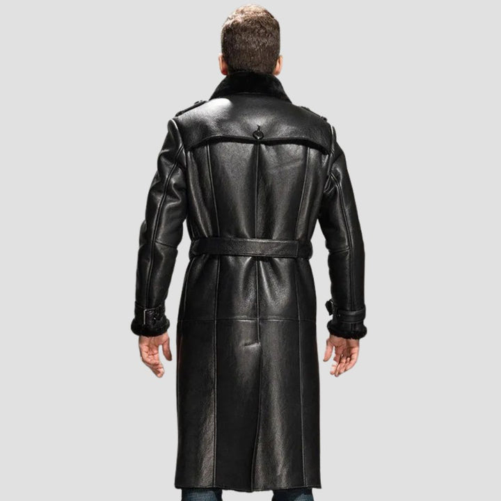 Close-up of a sleek black leather shearling coat for men, showcasing premium stitching details.