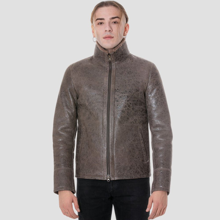 Vintage distressed sheepskin leather jacket with cozy faux fur interior.