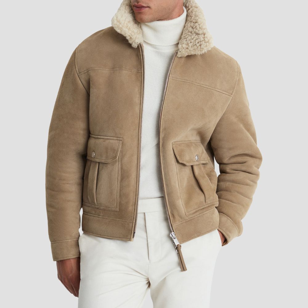 Stay warm and stylish this winter with this men’s suede leather bomber jacket, featuring a soft curly fur lining.