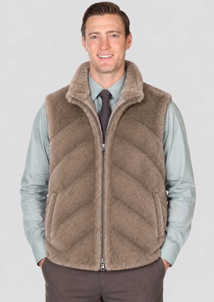 Men's taupe faux fur vest with stand collar and full zip front closure.