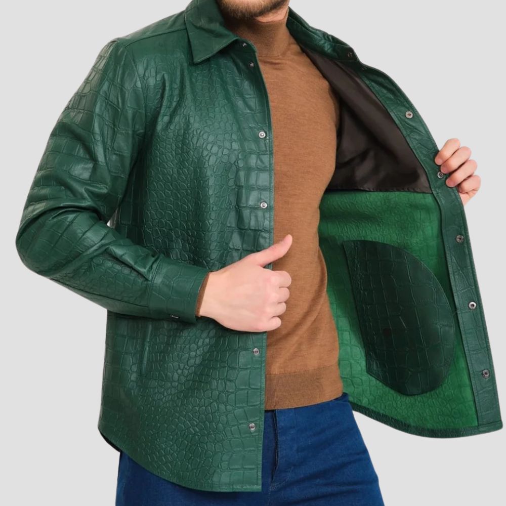 Close-up of a green leather shirt featuring crocodile-embossed texture and intricate detailing.