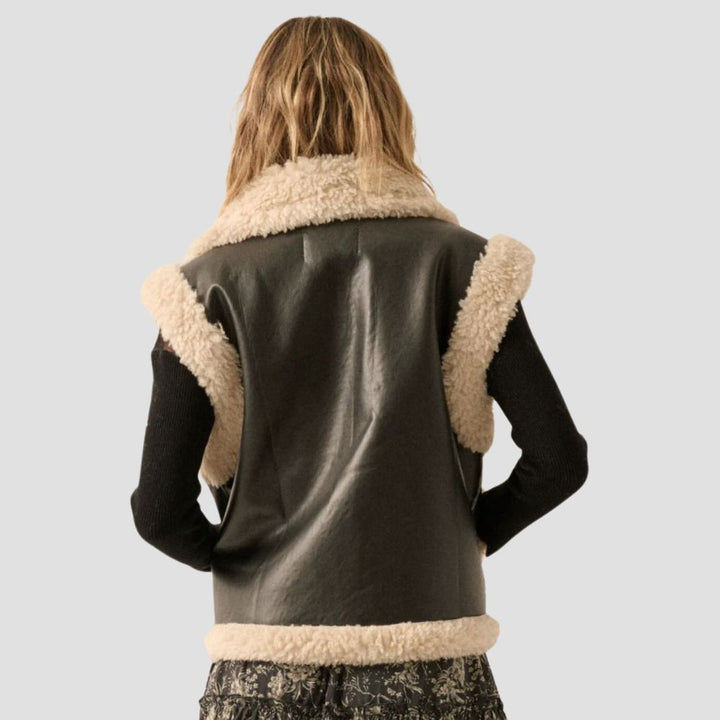 A premium fur-lined leather vest for women, this piece is perfect for adding a touch of luxury and elegance to your outfit while keeping you warm and stylish.