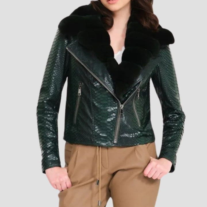  Embrace winter adventures with this rugged python shearling jacket for women. Its bold python design and cozy shearling lining offer warmth and stylish durability.