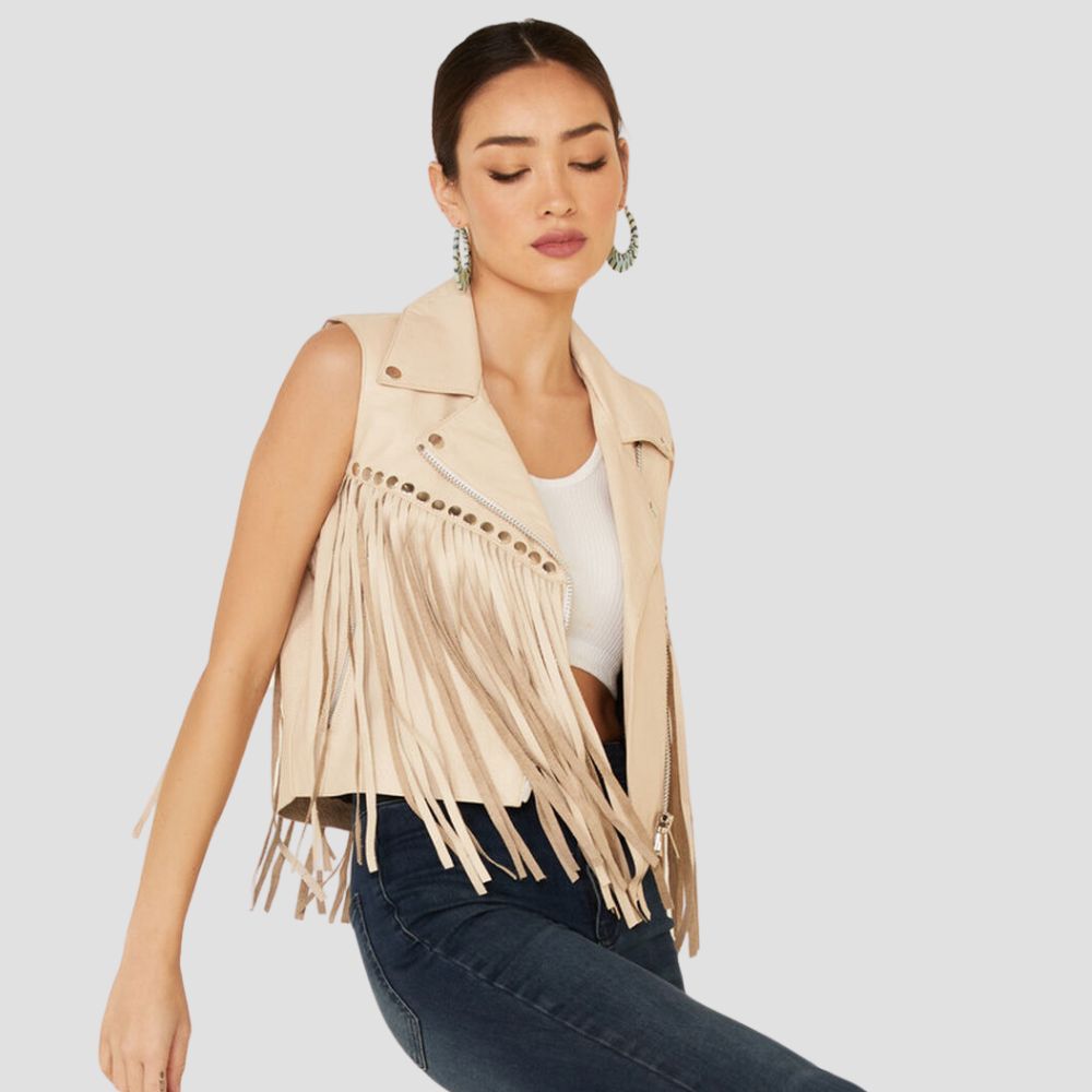 Cowgirl-inspired leather vest for women featuring long fringes and stud accents, ideal for those who love rugged, fashionable styles.