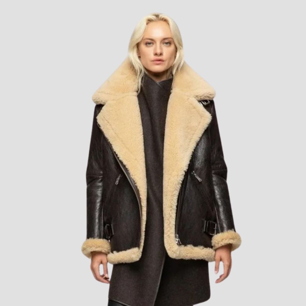 Elevate your wardrobe with this designer shearling leather jacket for women. Crafted for modern style, it combines luxurious shearling with sleek leather for a chic look.