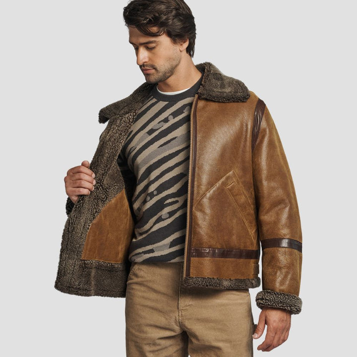 This timeless sheepskin leather jacket with shearling lining offers the perfect combination of rugged fashion and cozy warmth.