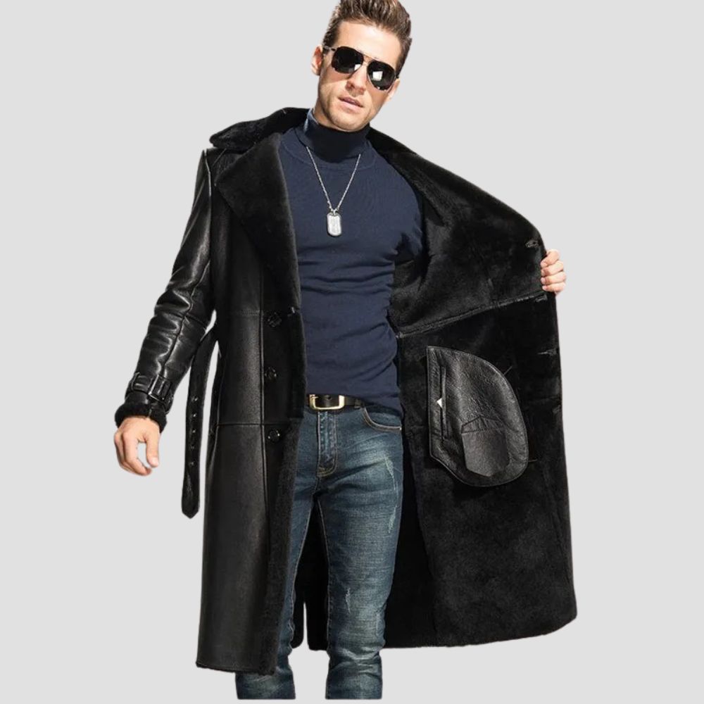 Front view of a men’s black leather shearling coat with a buttoned closure and soft fur interior.