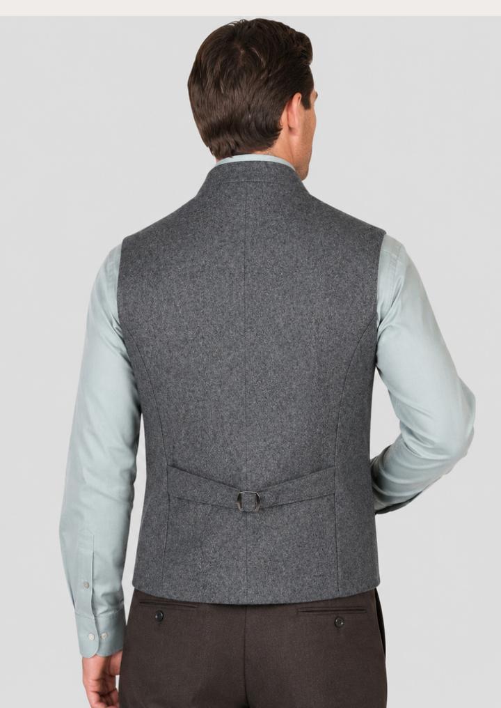 Traditional Bavarian waistcoat featuring jacquard fabric and green trim details