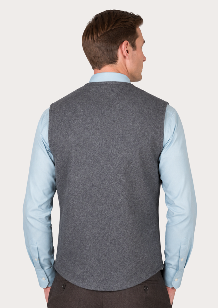 Traditional grey Loden vest with patch pockets for men and timeless Alpine elegance