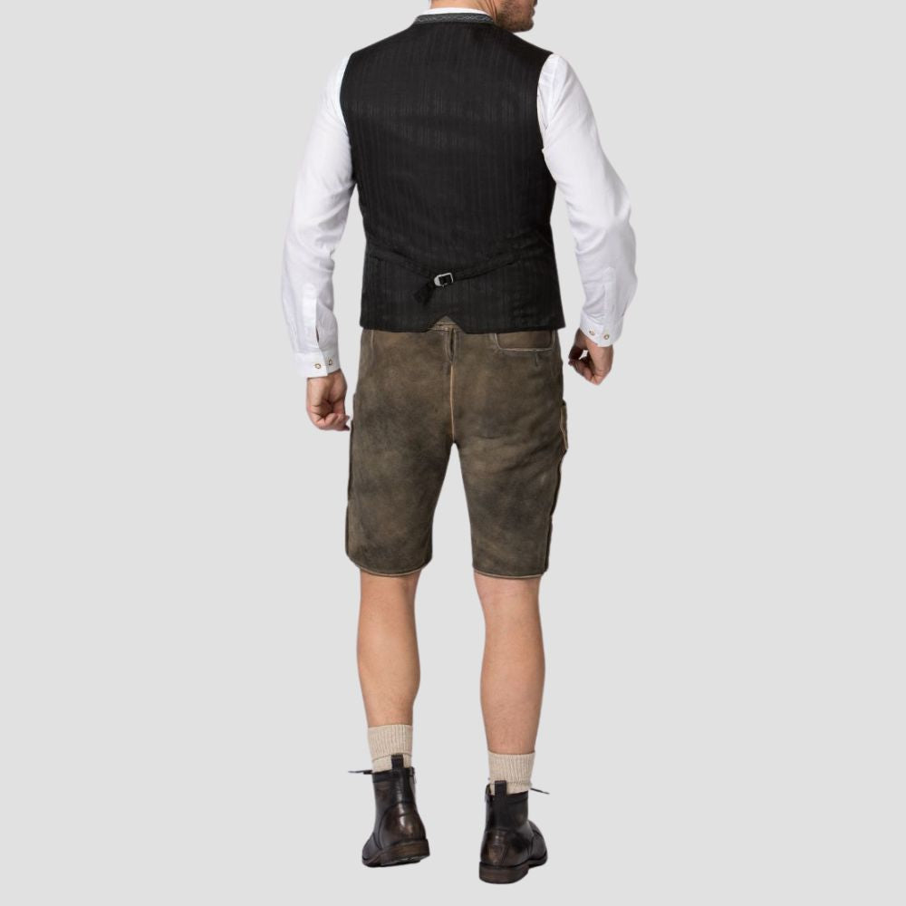This authentic Trachten vest with metal buttons adds a touch of sophistication to any cultural or formal gathering.