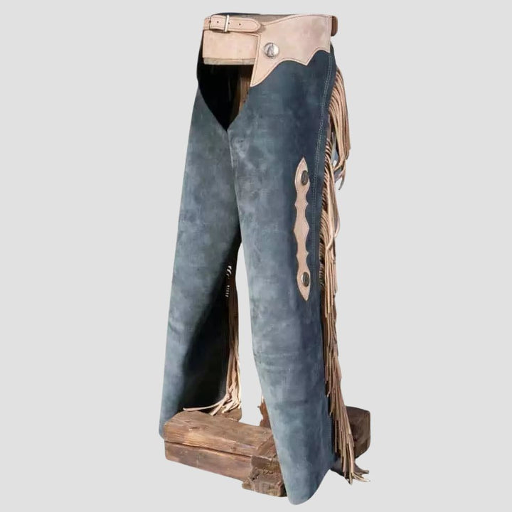 Add a touch of rugged elegance to your outfit with these trendy suede chaps, enhanced by eye-catching fringe accents.