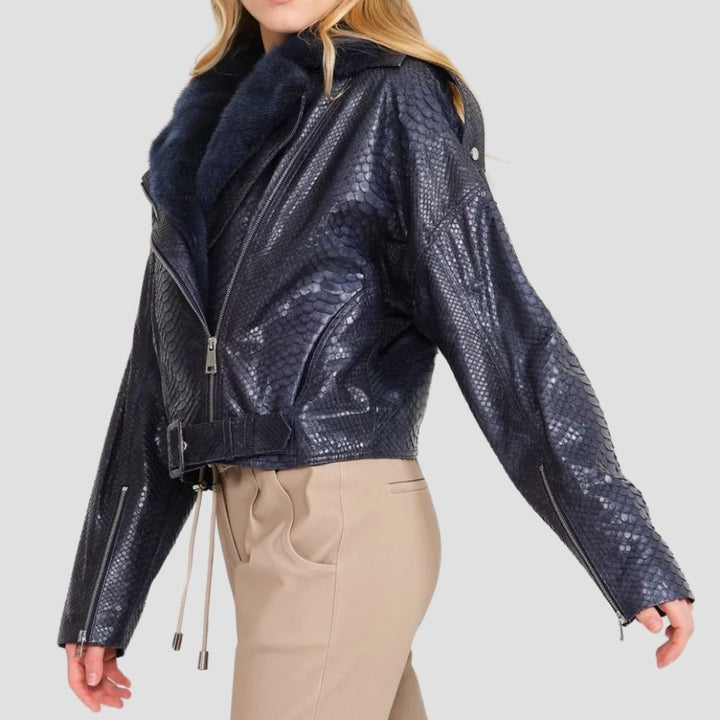 This snake skin moto jacket for women combines bold fashion with comfort. The unique snake skin design and plush shearling lining offer warmth and a chic, rebellious look.