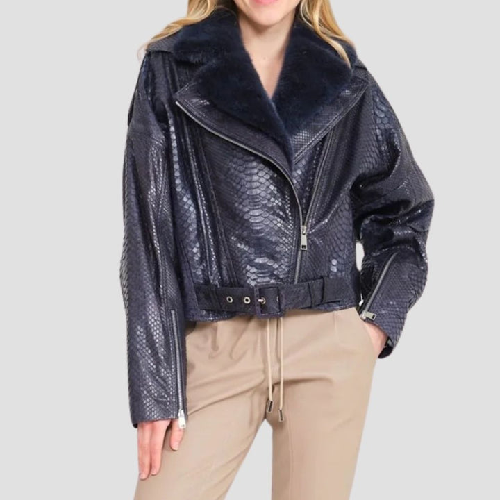 Make a bold fashion statement with this snake skin moto jacket for women. Featuring a sleek snake skin exterior and cozy shearling lining, it’s perfect for edgy style.