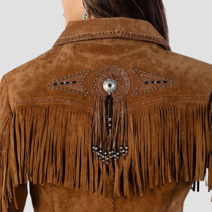 Shop a vintage Western suede leather jacket for women with fringes. The elegant design and fringe detailing create a timeless jacket that adds a chic Western touch to any outfit.
