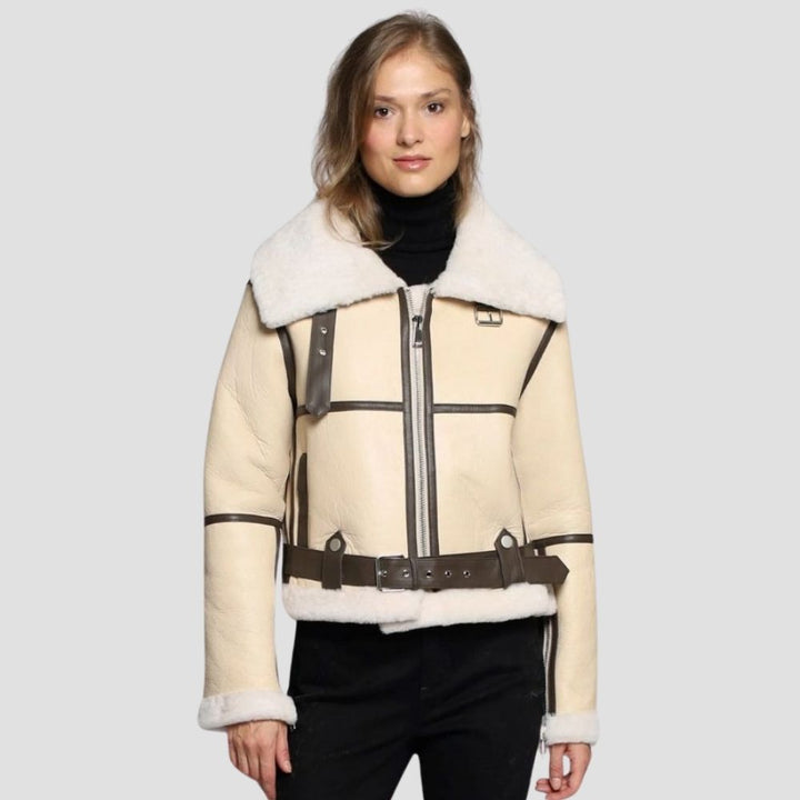 Stay cozy in this warm women’s shearling leather bomber jacket, perfect for cold weather. The plush shearling lining and sleek leather make it stylish and functional.