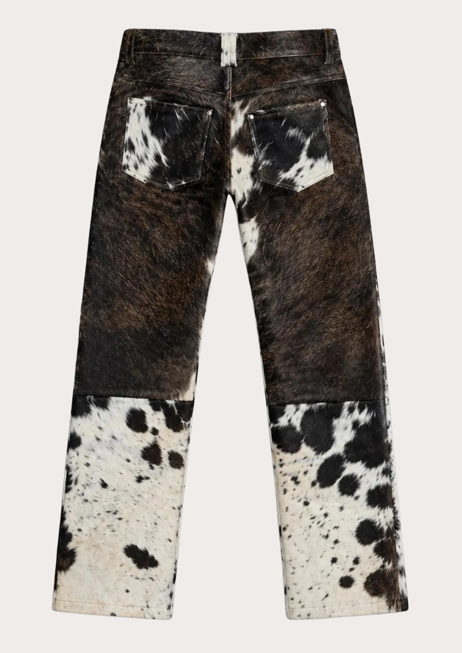 Hair on hide cowhide leather pants featuring a natural black white and brown pattern