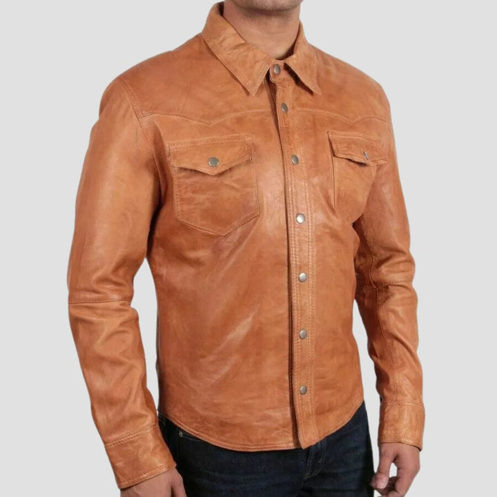 Stylish trucker leather shirt for men, featuring snap-button closures and chest pockets.