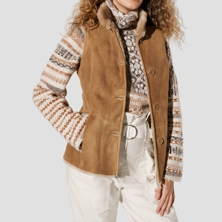 Cozy suede sherpa fur vest, ideal for women who want to stay warm while adding a stylish layer to their winter outfits.